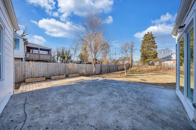 view of yard featuring a patio area and a fenced backyard