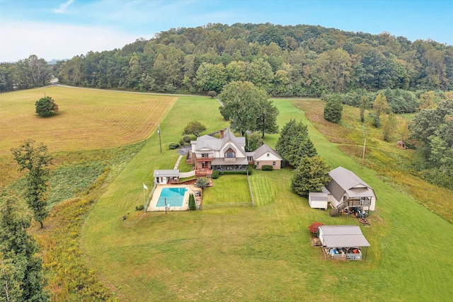 aerial view with a rural view and a view of trees