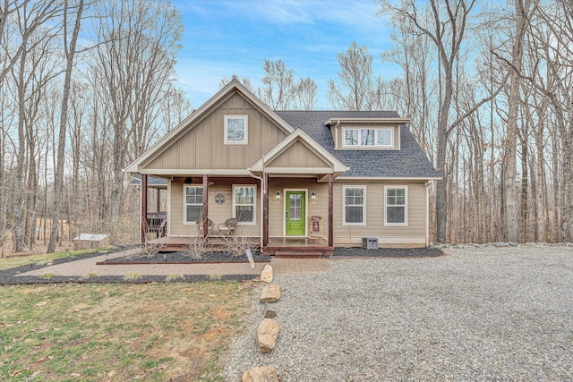 view of front of property featuring covered porch and roof with shingles