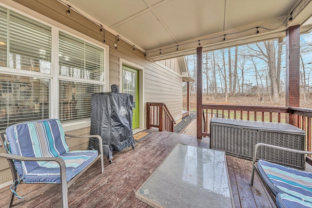 wooden terrace featuring outdoor dining area