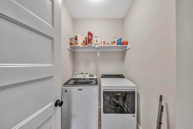 laundry room featuring laundry area and separate washer and dryer