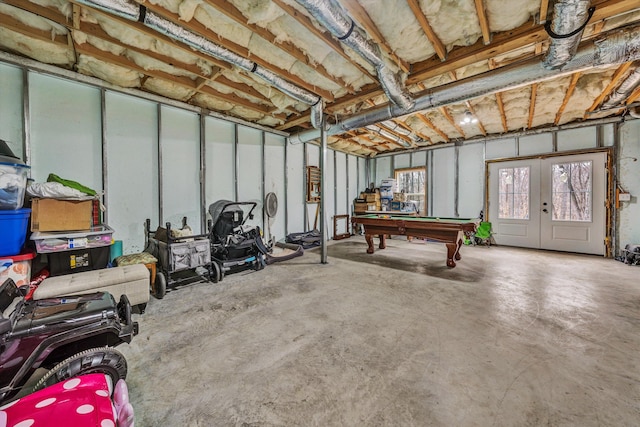 game room featuring pool table, concrete floors, and french doors