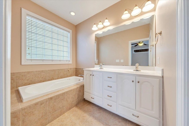 full bathroom with a garden tub, double vanity, a sink, and tile patterned floors