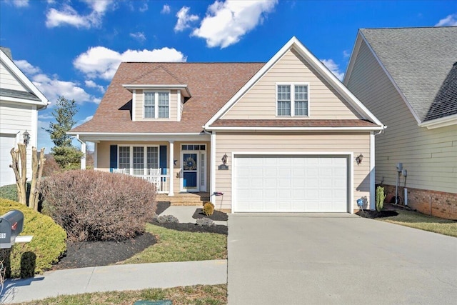 traditional-style house featuring a porch and concrete driveway