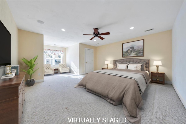 carpeted bedroom featuring ceiling fan, recessed lighting, visible vents, and baseboards