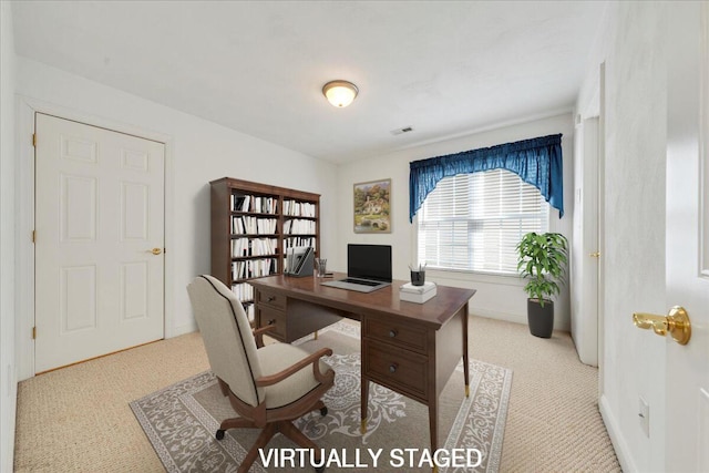 carpeted home office with visible vents and baseboards