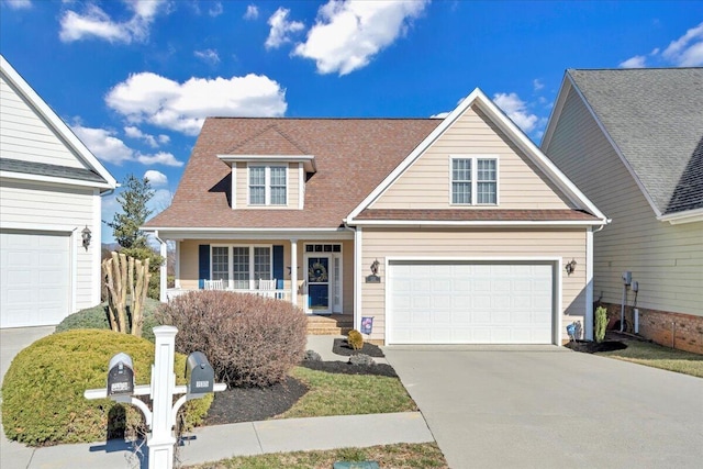 view of front facade featuring a garage, concrete driveway, and covered porch