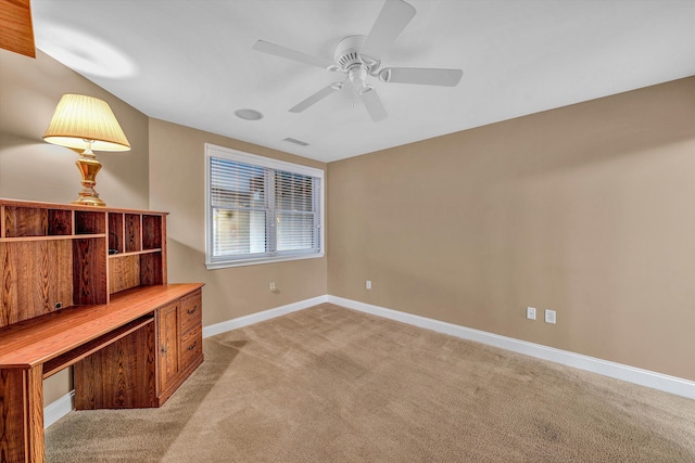 spare room featuring visible vents, baseboards, ceiling fan, and light colored carpet