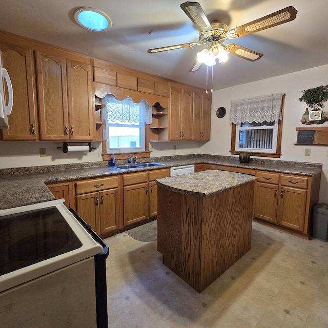 kitchen featuring brown cabinetry, a kitchen island, open shelves, and light floors