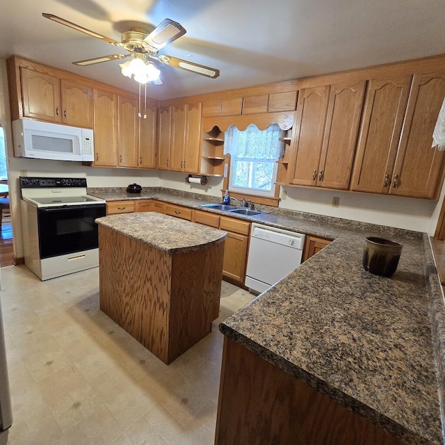 kitchen with white appliances, a kitchen island, light floors, open shelves, and a sink