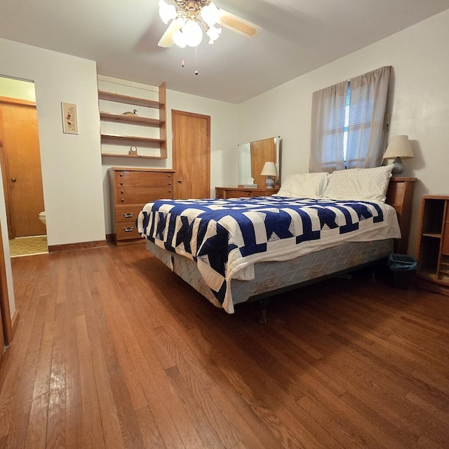 bedroom featuring baseboards, a ceiling fan, and hardwood / wood-style floors