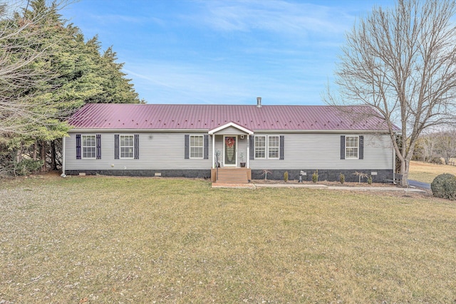 view of front of property featuring metal roof, crawl space, and a front yard