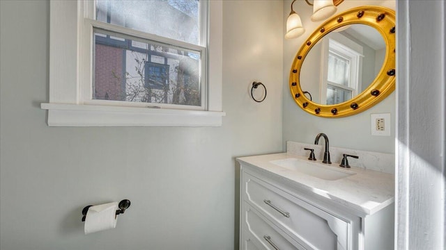 bathroom featuring plenty of natural light and vanity