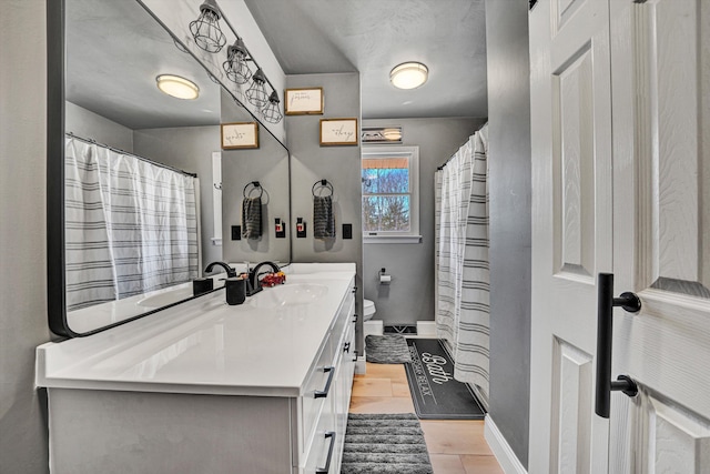 5359 Booker T Washington Hwy, Rocky Mount, VA 24151 - bathroom with baseboards, vanity, and toilet