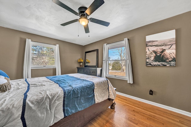 5359 Booker T Washington Hwy, Rocky Mount, VA 24151 - bedroom featuring baseboards, wood finished floors, and a ceiling fan