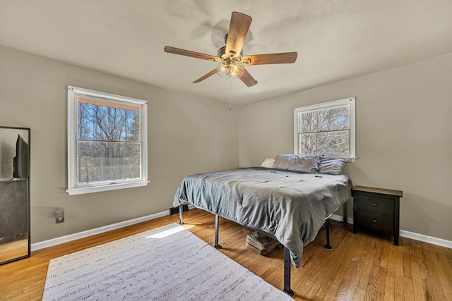 5359 Booker T Washington Hwy, Rocky Mount, VA 24151 - bedroom with multiple windows, hardwood / wood-style flooring, and baseboards