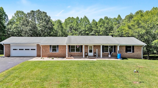 5359 Booker T Washington Hwy, Rocky Mount, VA 24151 - ranch-style house featuring an attached garage, driveway, a front yard, a porch, and brick siding