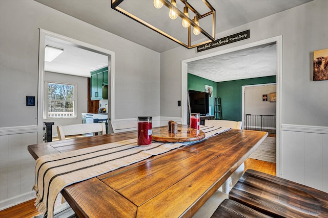 5359 Booker T Washington Hwy, Rocky Mount, VA 24151 - dining space with wood finished floors, a chandelier, and wainscoting
