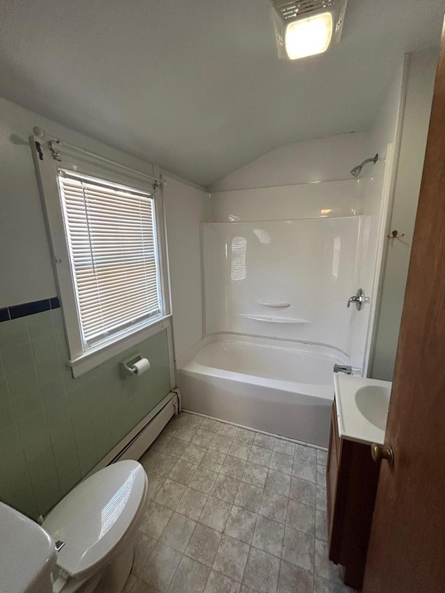 full bathroom featuring vaulted ceiling,  shower combination, vanity, and toilet