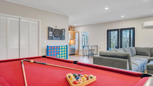 rec room featuring pool table, a wall mounted air conditioner, a wealth of natural light, and recessed lighting