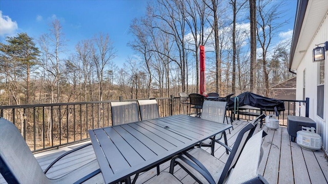 wooden deck featuring outdoor dining space