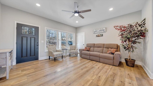 living area featuring recessed lighting, ceiling fan, light wood-style flooring, and baseboards