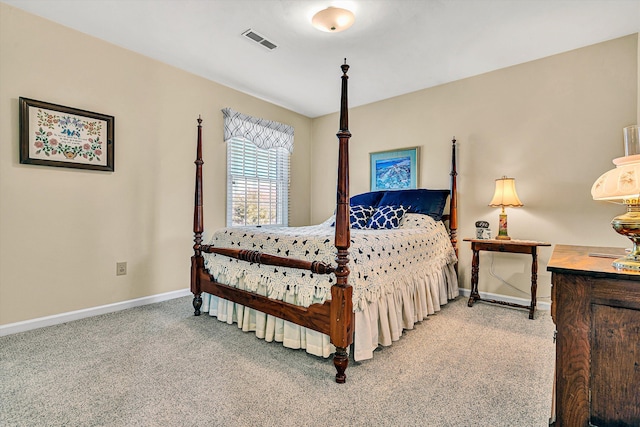 carpeted bedroom with visible vents and baseboards