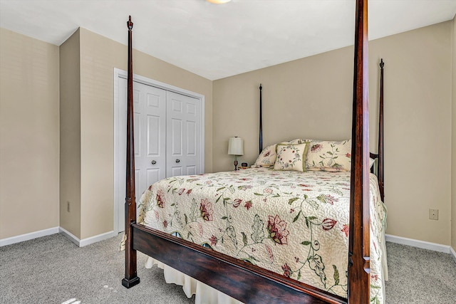 bedroom featuring a closet, carpet flooring, and baseboards