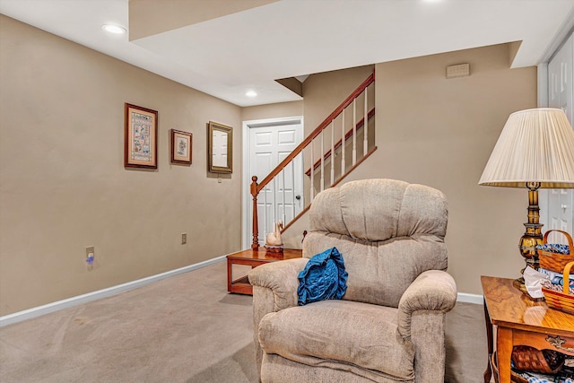 sitting room with recessed lighting, carpet flooring, baseboards, and stairs