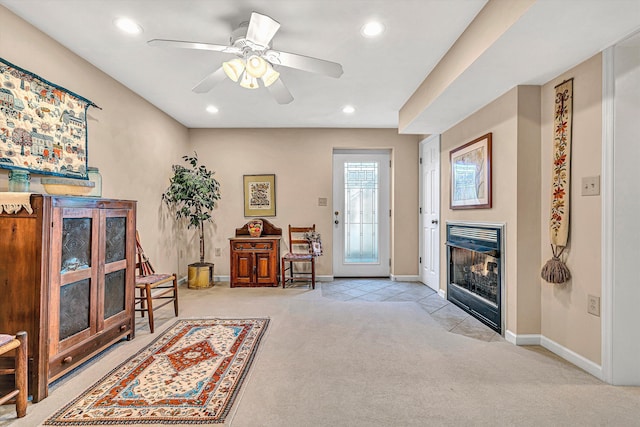 sitting room featuring recessed lighting, carpet, baseboards, and a fireplace with flush hearth