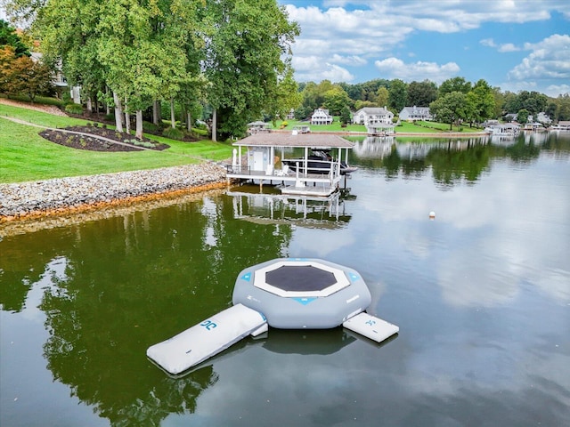 dock area with a water view and boat lift