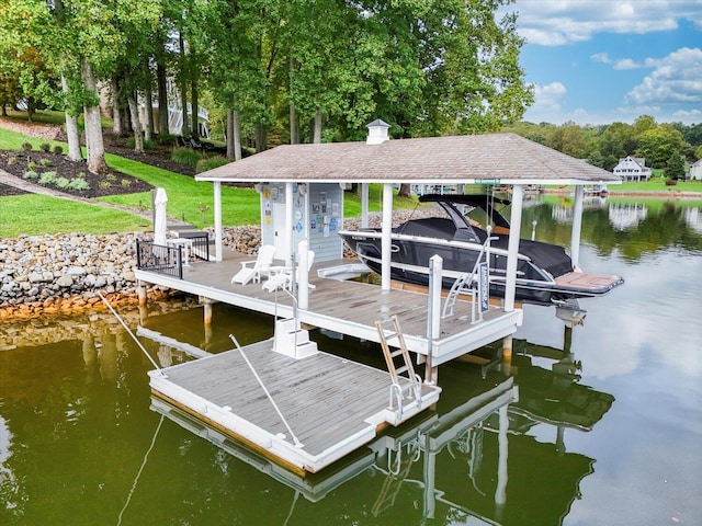 dock area featuring a water view and boat lift