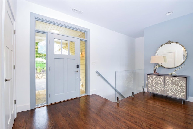 foyer featuring dark wood-type flooring, visible vents, and recessed lighting