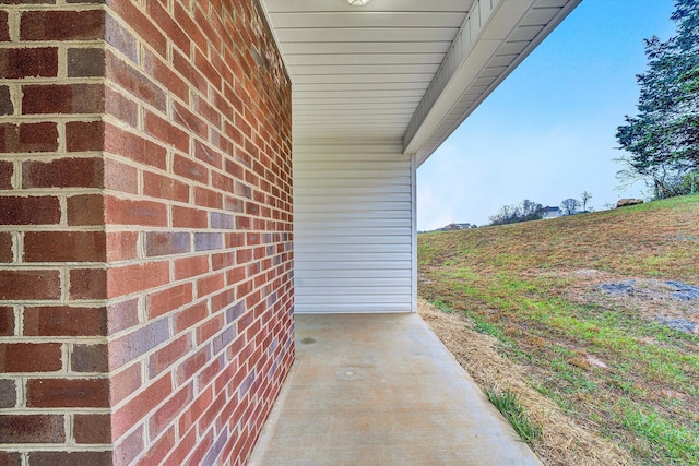 property entrance with brick siding