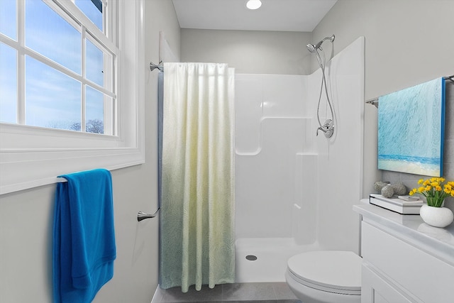 full bath with a shower with shower curtain and toilet