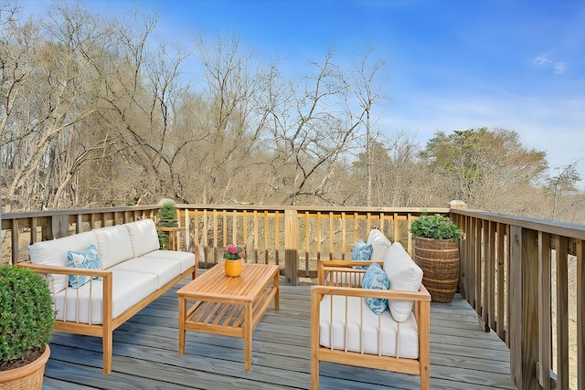 wooden terrace featuring outdoor lounge area