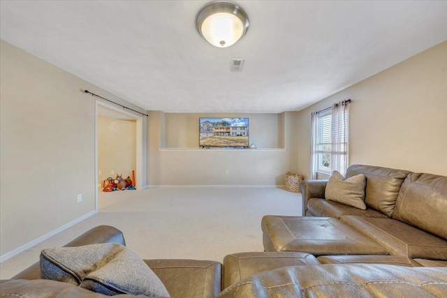 carpeted living area with visible vents and baseboards