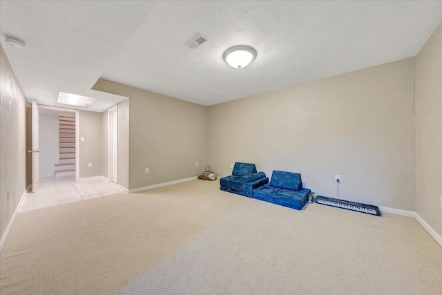 interior space with baseboards, visible vents, stairway, and carpet flooring