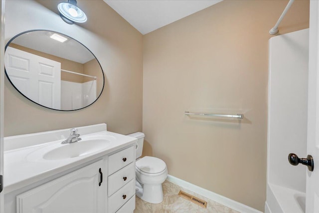 bathroom featuring toilet, baseboards, visible vents, vanity, and bathing tub / shower combination