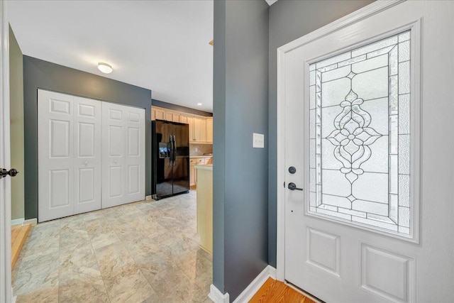entrance foyer featuring baseboards