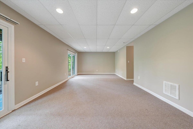 carpeted empty room with baseboards, recessed lighting, and visible vents