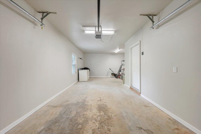 garage featuring baseboards and a garage door opener