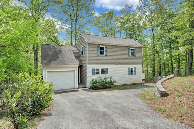 view of front of property with a garage and driveway