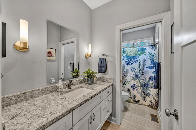 full bath featuring toilet, curtained shower, visible vents, and vanity