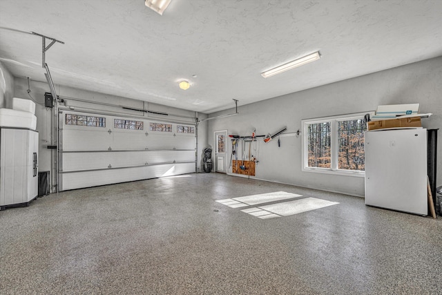 garage featuring freestanding refrigerator