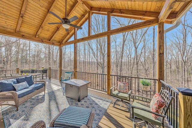 sunroom featuring wood ceiling and a healthy amount of sunlight