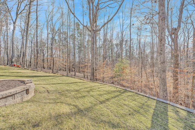 view of yard with a forest view