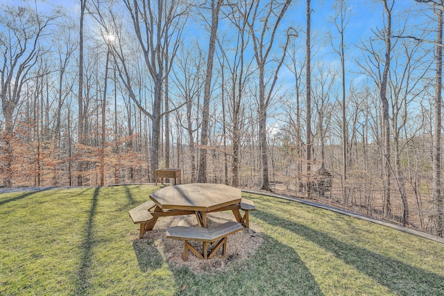 view of yard with a forest view