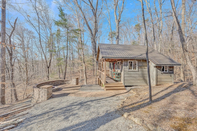 view of side of property featuring metal roof