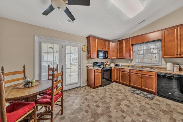 kitchen with black appliances, visible vents, and brown cabinets